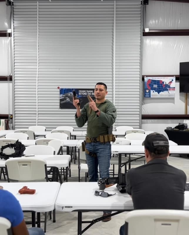 Instructor working with students on the range